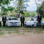 groomsmen with their cars