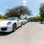 white luxury cars lined up